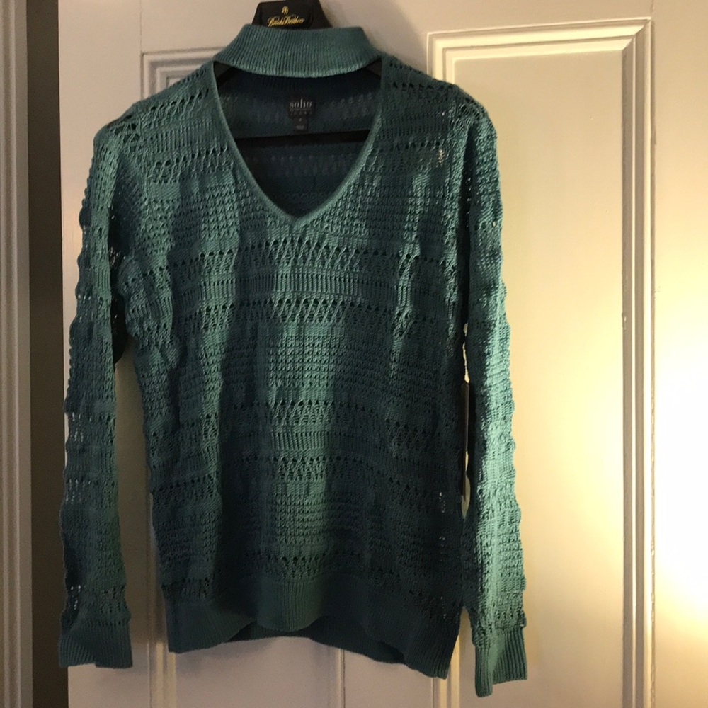 Ribbed deep V teal sweater.